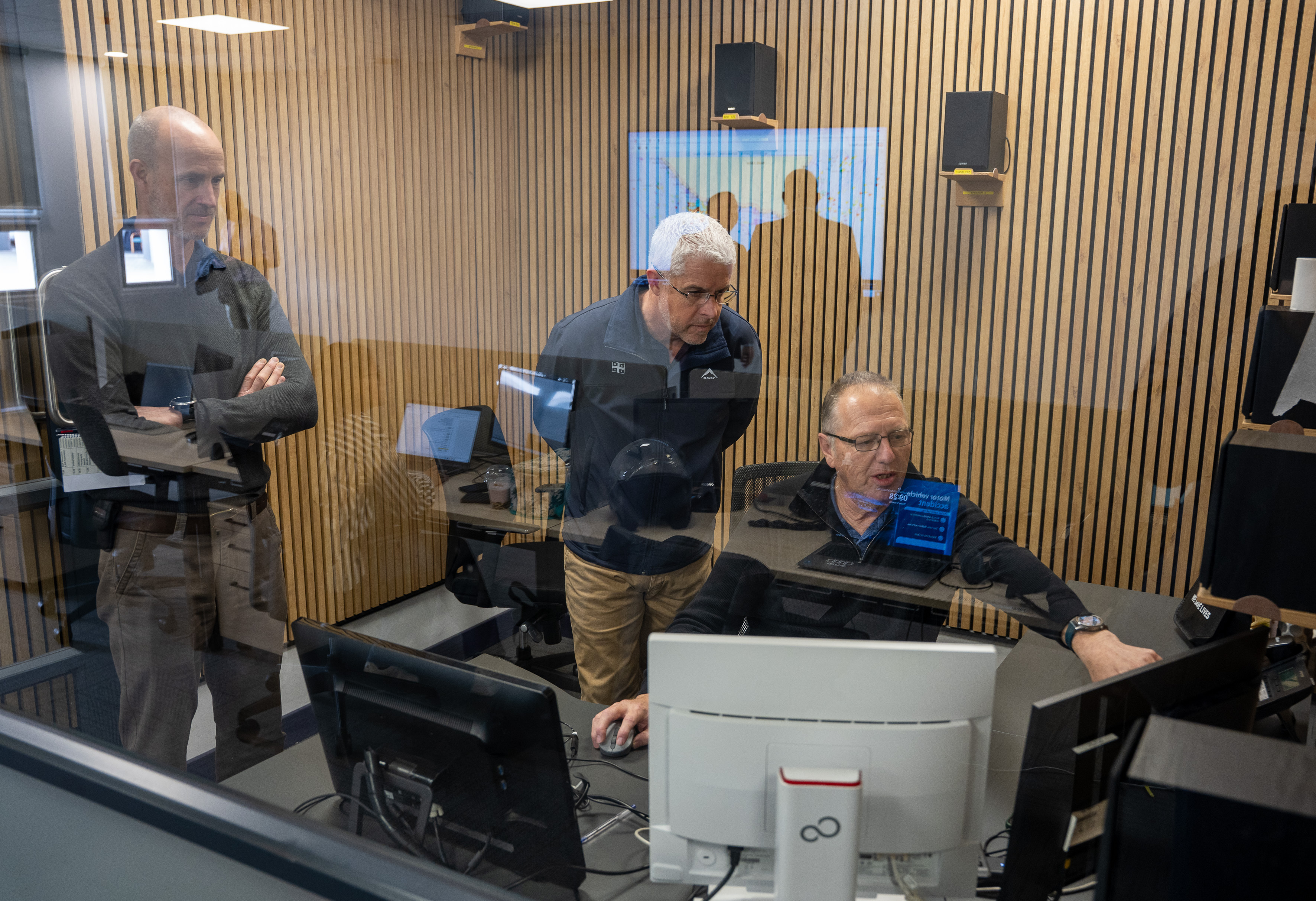 NSRI Head of Operations, Charl Maritz and CEO Mike Vonk, listen to Mark Roux who was on duty at Cape Town Radio in Milnerton. A Global Search and Rescue Day event was held at Cape Town Radio to mark the day. Picture Andrew Ingram / NSRI