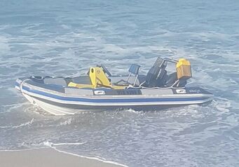 RIB washed up on beach